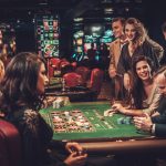 Upper class friends gambling in a casino
